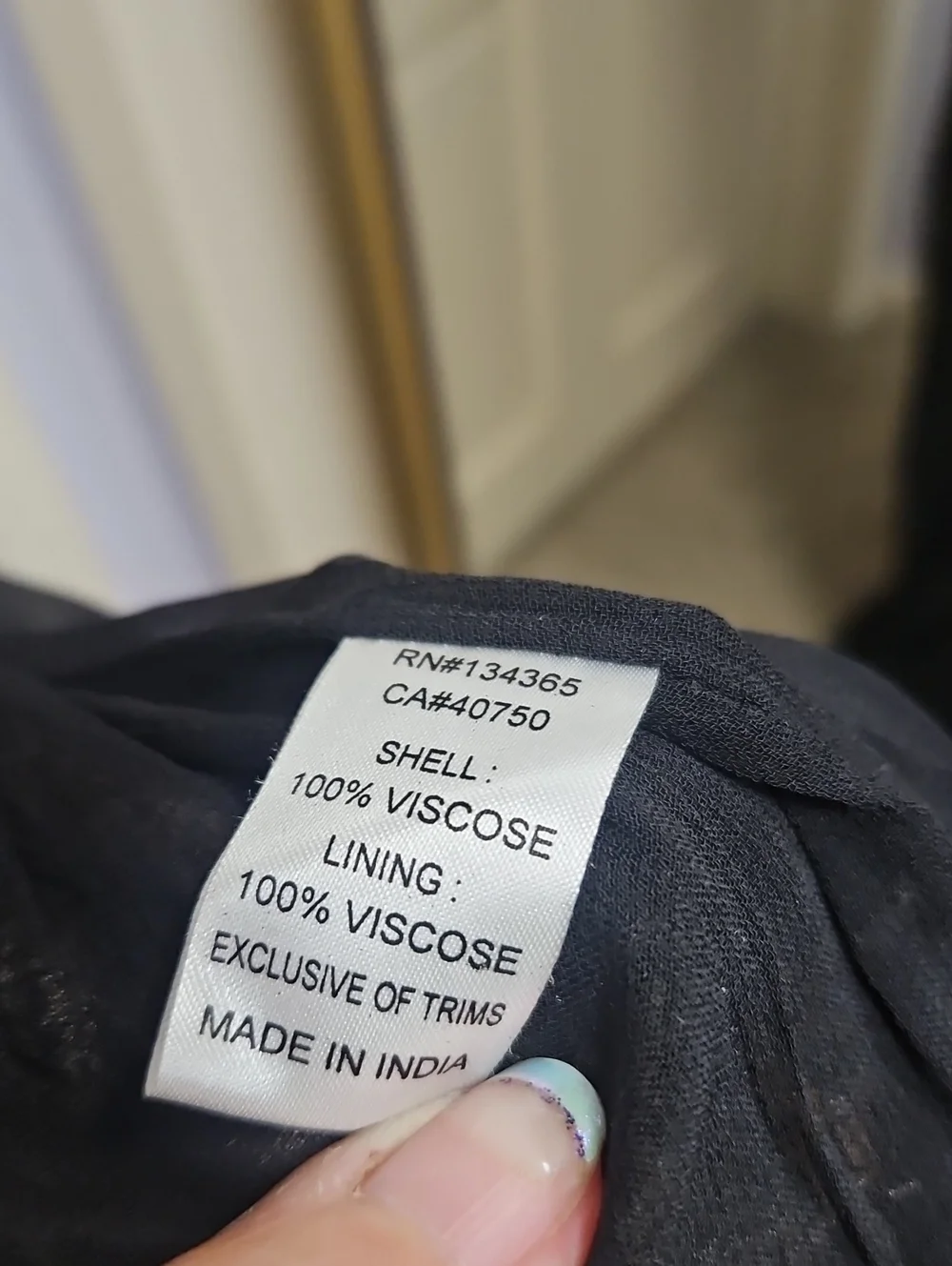 Sigrid Olsen Black Top with Yellow-Green Label Detail